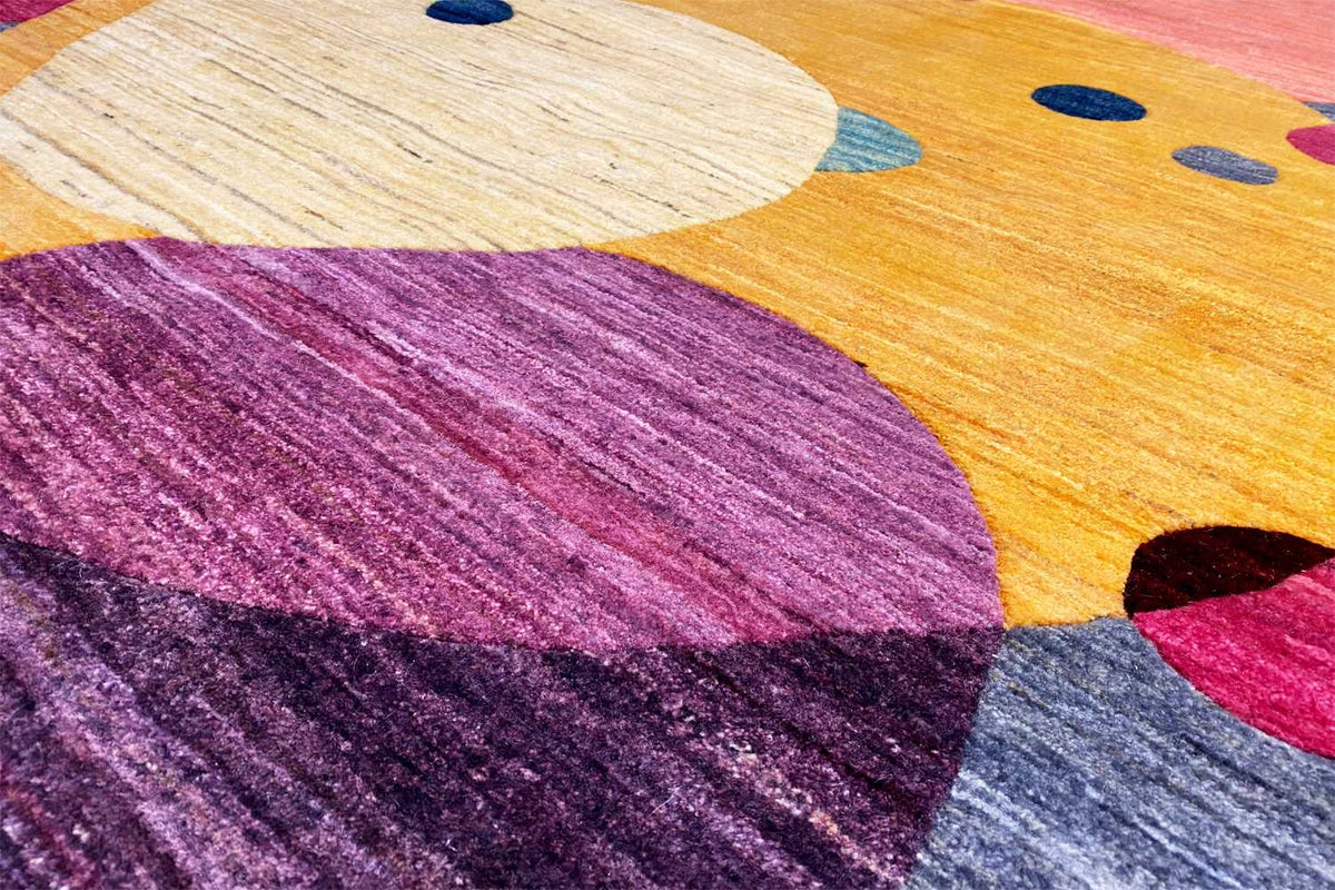 Gabbeh rug close-up of the pattern, yellow area with a purple shape and dots