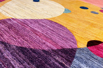 Gabbeh rug close-up of the pattern, yellow area with a purple shape and dots