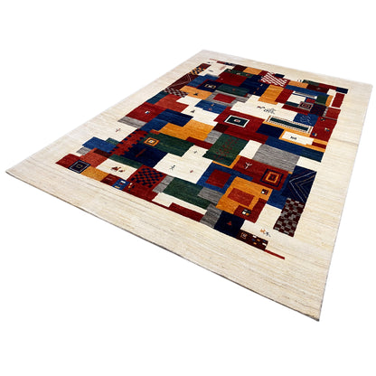 Gabbeh rug angled view, patchwork of color fields and ornaments in beige, blue, red
