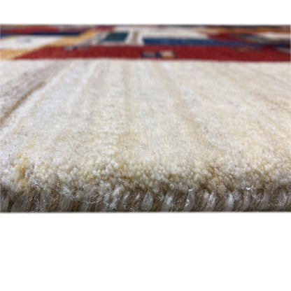 Gabbeh rug pile close-up: beige, dense textile with a soft, shimmering surface