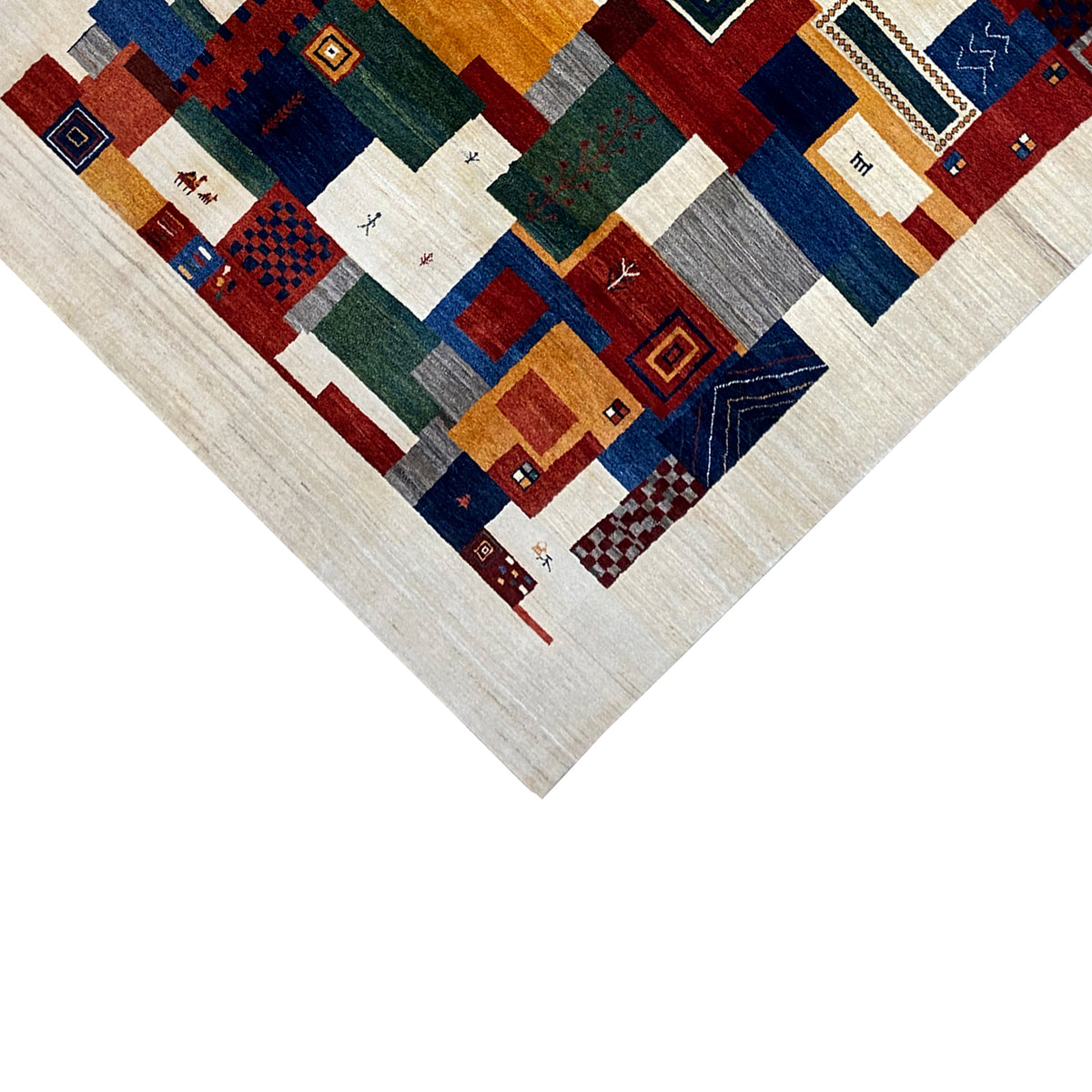 Close-up of Gabbeh rug: geometric squares and lines, beige with shades of red and blue