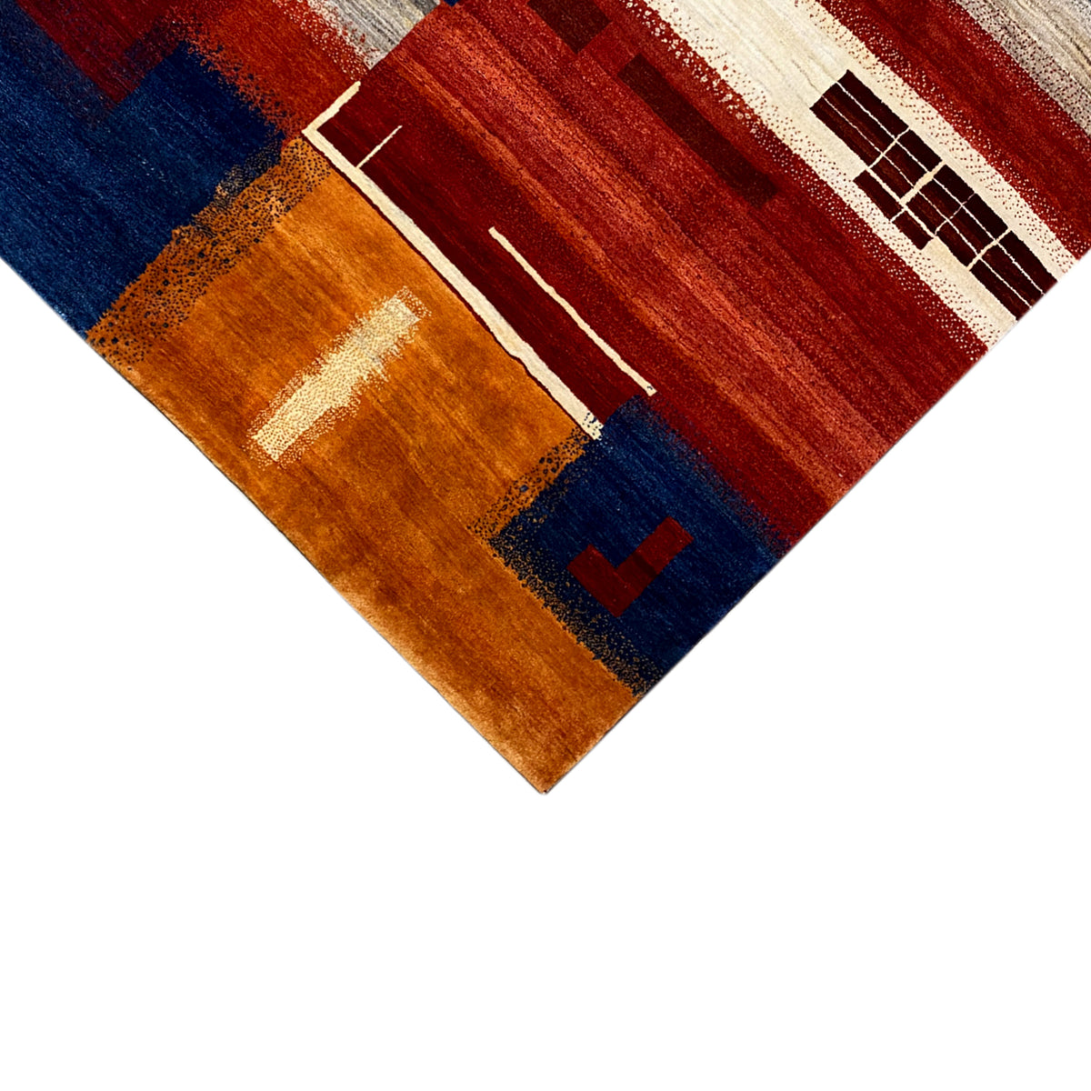 Gabbeh rug with corner perspective: geometric fields in red, blue, brown, and beige