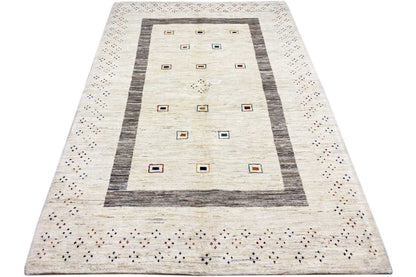 Natural Gabbeh rug, beige center with a gray striped border and small squares