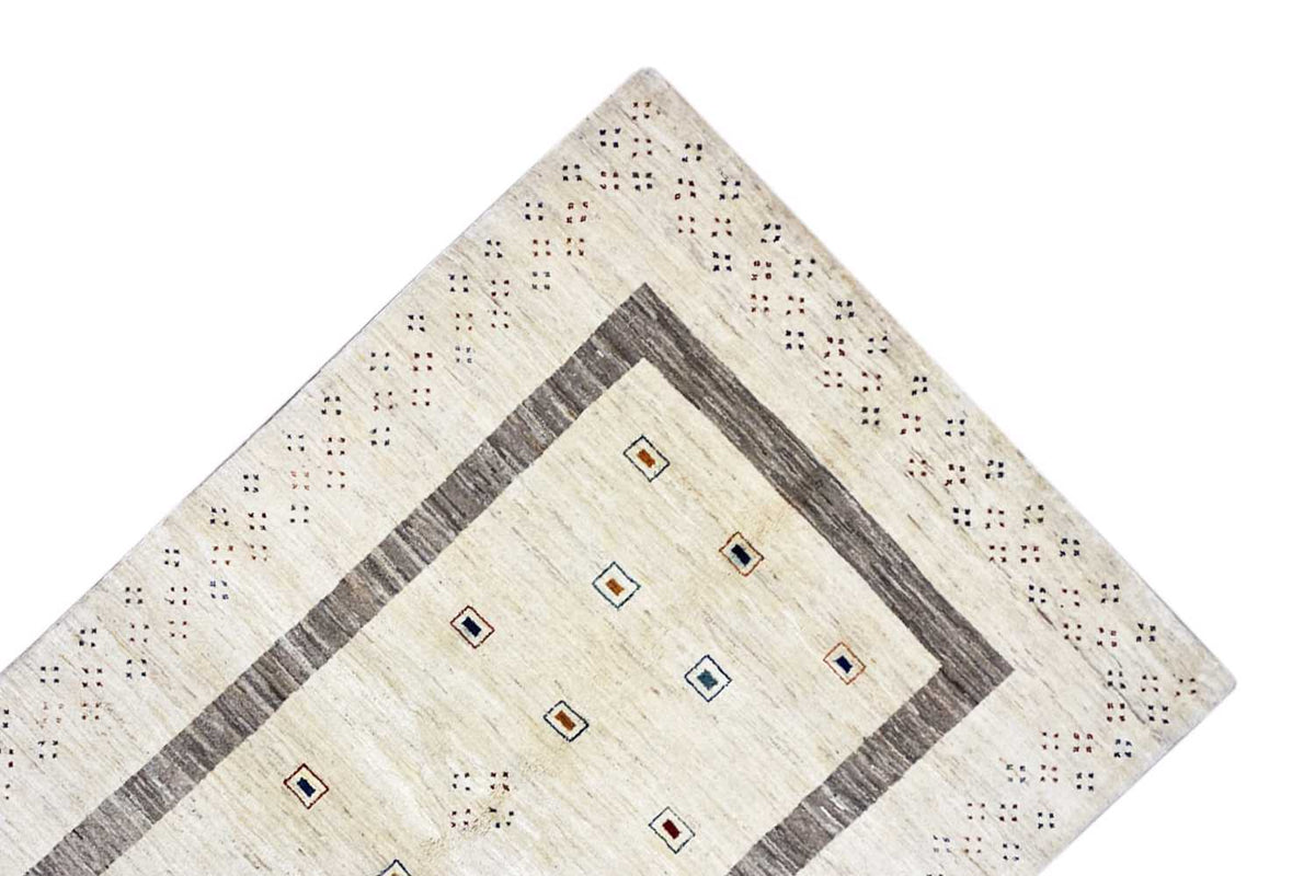 Gabbeh rug made of natural fibers with a beige pattern, gray border, and square motifs