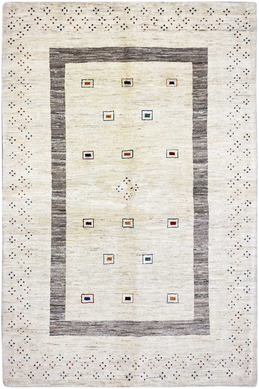 Natural Gabbeh rug with a beige base, gray border, and colorful square-pattern details