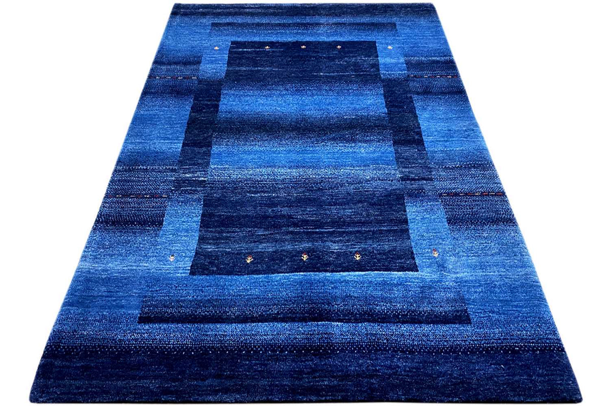 Blue Gabbeh rug 170x240 cm, triangular view: blue geometric field pattern