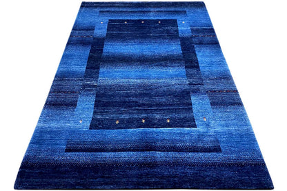 Blue Gabbeh rug 170x240 cm, triangular view: blue geometric field pattern