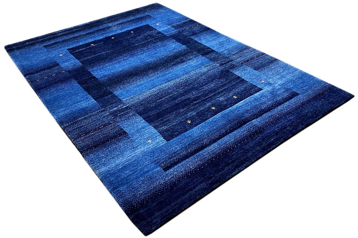 Blue Gabbeh rug 170x240 cm, angled: blue grid pattern with fine accents