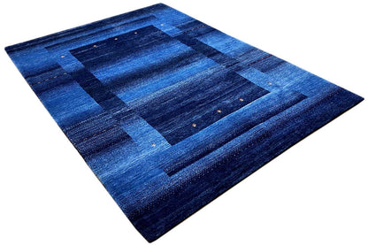 Blue Gabbeh rug 170x240 cm, angled: blue grid pattern with fine accents