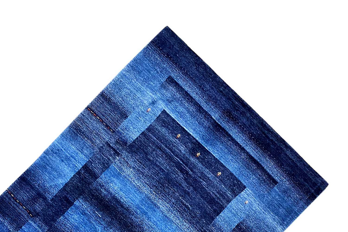 Blue Gabbeh rug, border detail: blue striped and diamond pattern