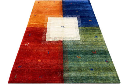 Multicolored Gabbeh rug at a low angle: multicolored fields with a central pattern