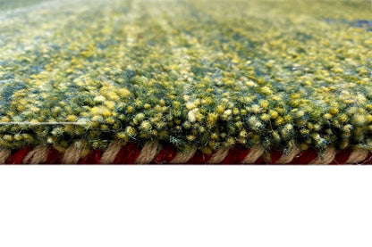 Close-up of a multicolored Gabbeh rug: pile and colored border with fringe