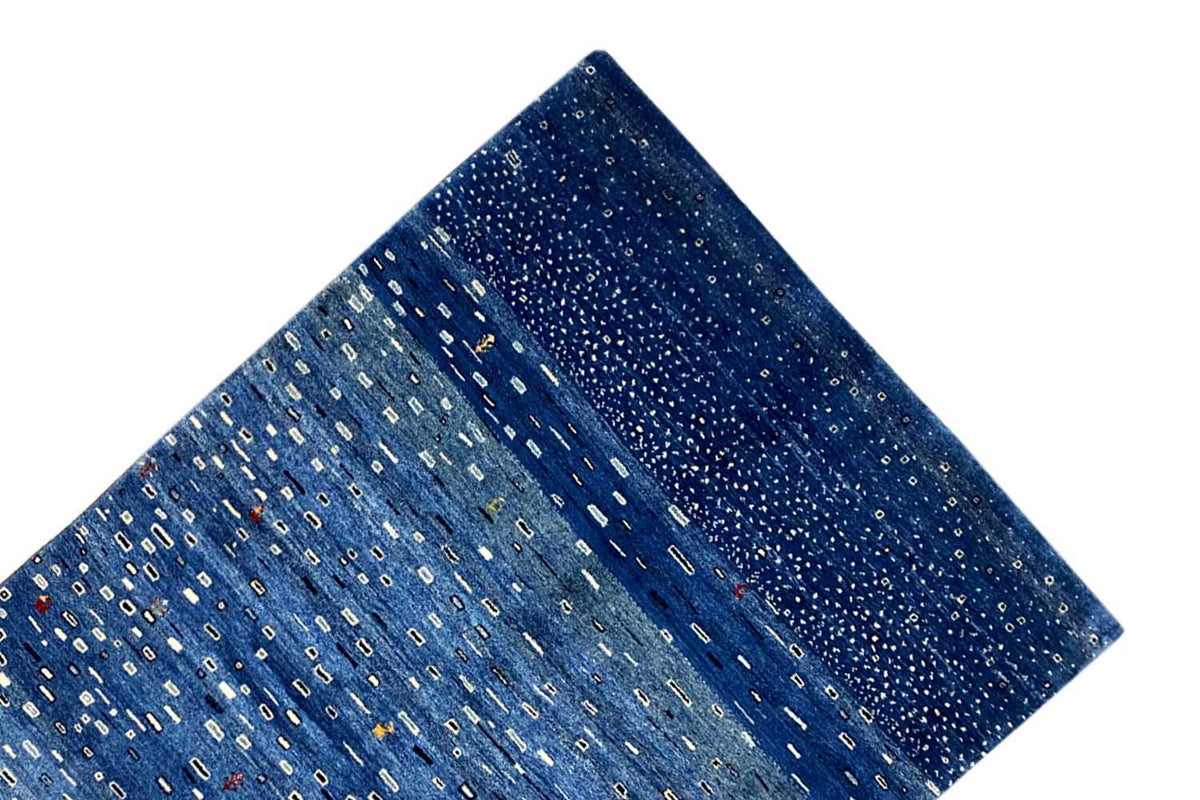 Blue Gabbeh rug, diagonal close-up showing the pile and continuous pattern