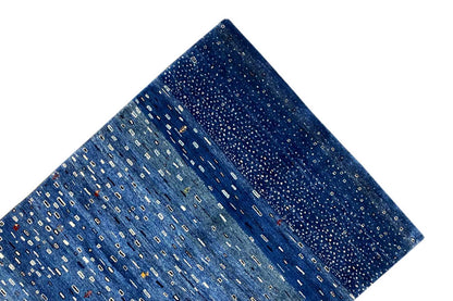 Blue Gabbeh rug, diagonal close-up showing the pile and continuous pattern