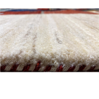 Gabbeh rug pile view: dense beige wool pile with a colorful edge