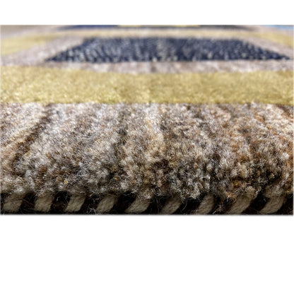 Gabbeh rug close-up of the pile height: gray-brown, knotted surface.