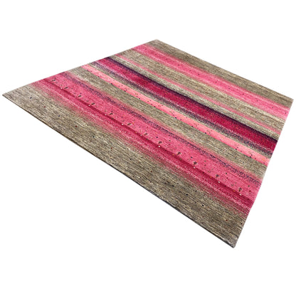Pink gabbeh rug: wide horizontal stripes on a gray background, visibly mottled