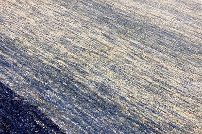Close-up: blue runner rug 100x250 cm with a mottled, finely patterned pile.