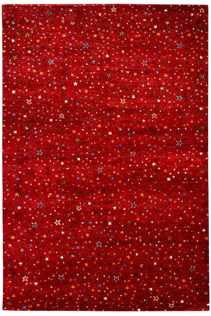 Gabbeh rug “Lori” 246x176 cm, front view with a dense star pattern in red