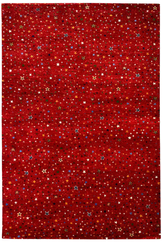 Gabbeh rug “Lori” 246x176 cm, front view with a dense star pattern in red