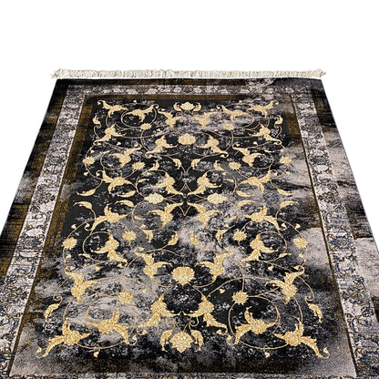 Kenza rug 160x230 cm: close-up of the floral gold pattern on a dark background