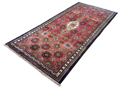 Oriental rug, red ornamental design with a central medallion and blue border