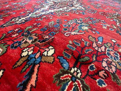 Red Hamadan oriental rug with ornamental paisley pattern and woven medallion