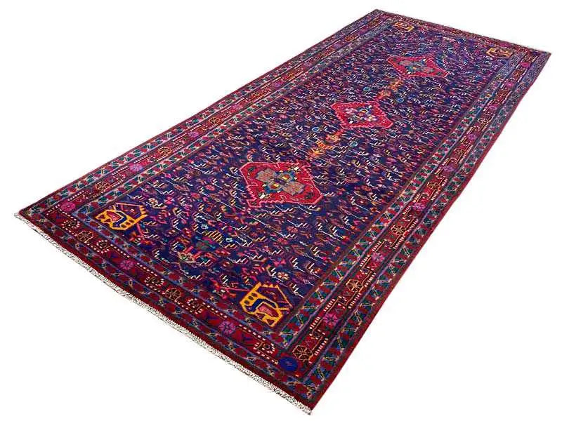 Oriental rug, laid diagonally, dark blue with colorful ornaments and a border