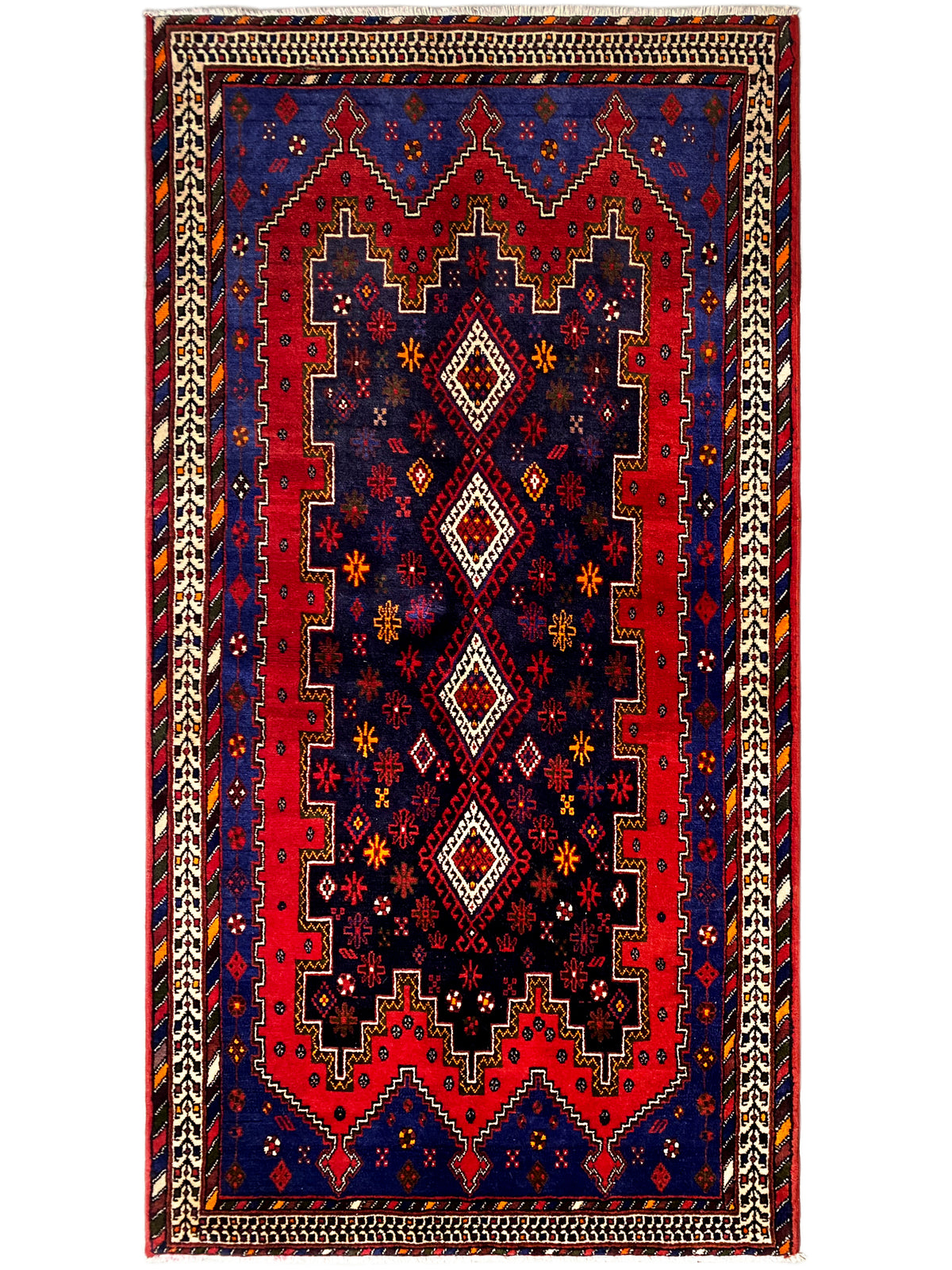 Rectangular runner rug with dark blue, a red ornamental center, and a beige border