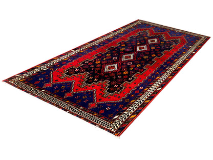Sirjan runner rug with a red and blue ornamental pattern, dark medallions