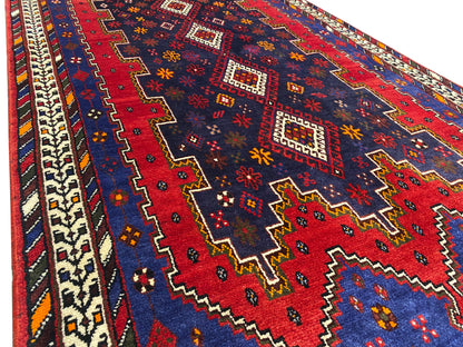 Sirjan runner rug surface with a fine geometric pattern in blue, red and beige