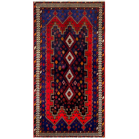 Rectangular runner rug with a blue-red pattern, beige border, and decorative trim