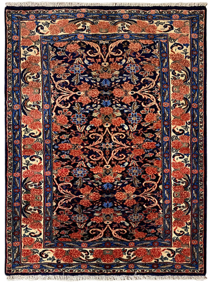 Rectangular rug with blue-red floral ornament and border, 142×102 cm