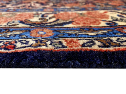 Close-up of the pile surface with blue-red ornamental details and a dense texture