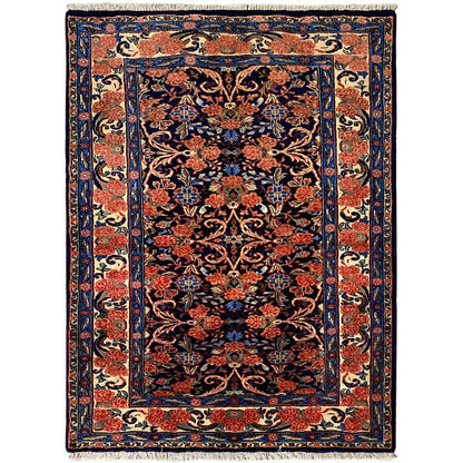 Rectangular rug with a dark blue-red ornamental pattern and border, 142×102 cm
