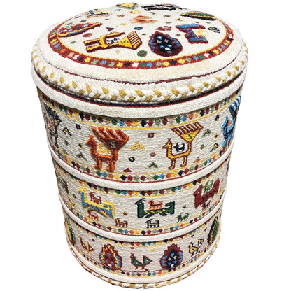 Round stool with a patterned seat cushion and striped decorative elements in an ethnic style