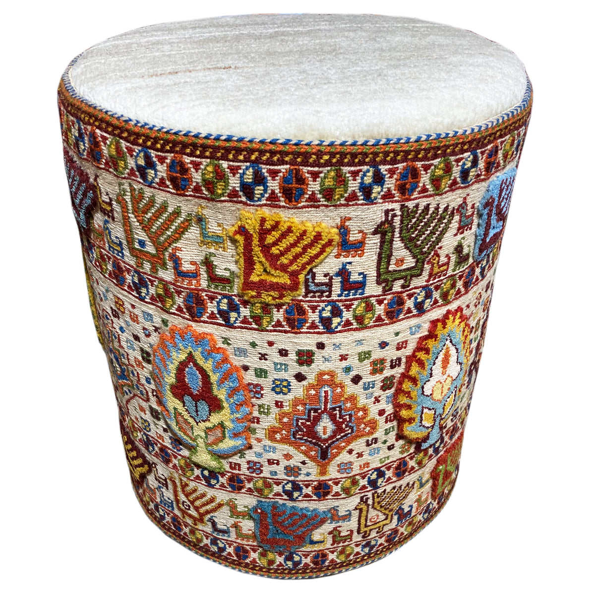 Round wool stool with a padded light-colored seat and multicolored patterned fabric