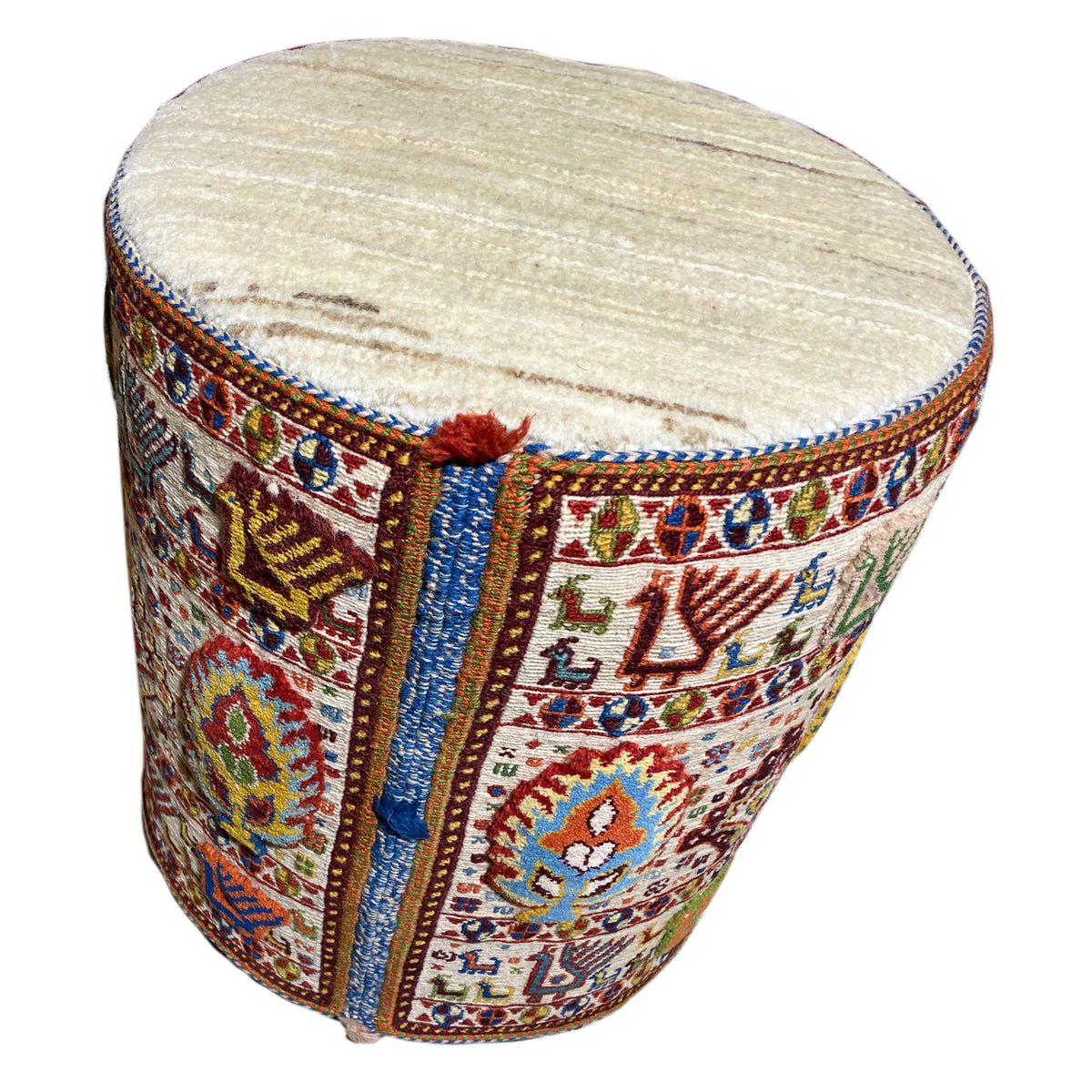 Round wool stool, side view, with a padded light-colored top