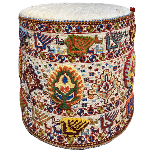 Round wool stool with a multicolored Soumak rug pattern and padded seat
