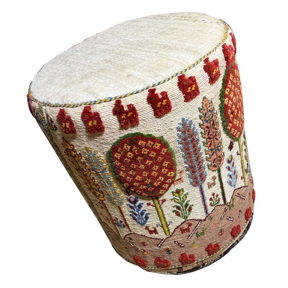 Colorful Soumak stool with round seat cushion and ornate cover, angled view