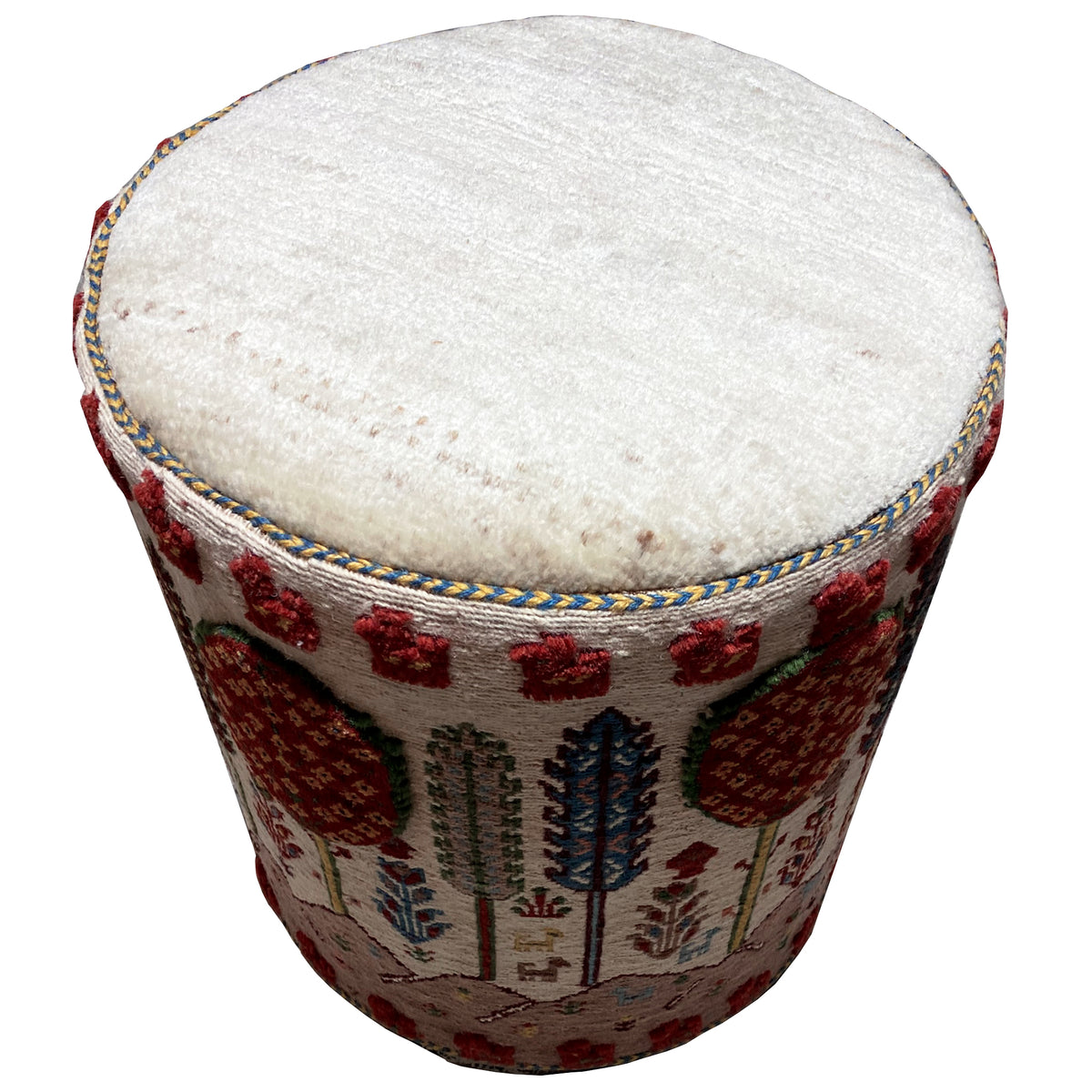 Colorful Soumak footstool with a round seat cushion and a multicolored decorative rug pattern
