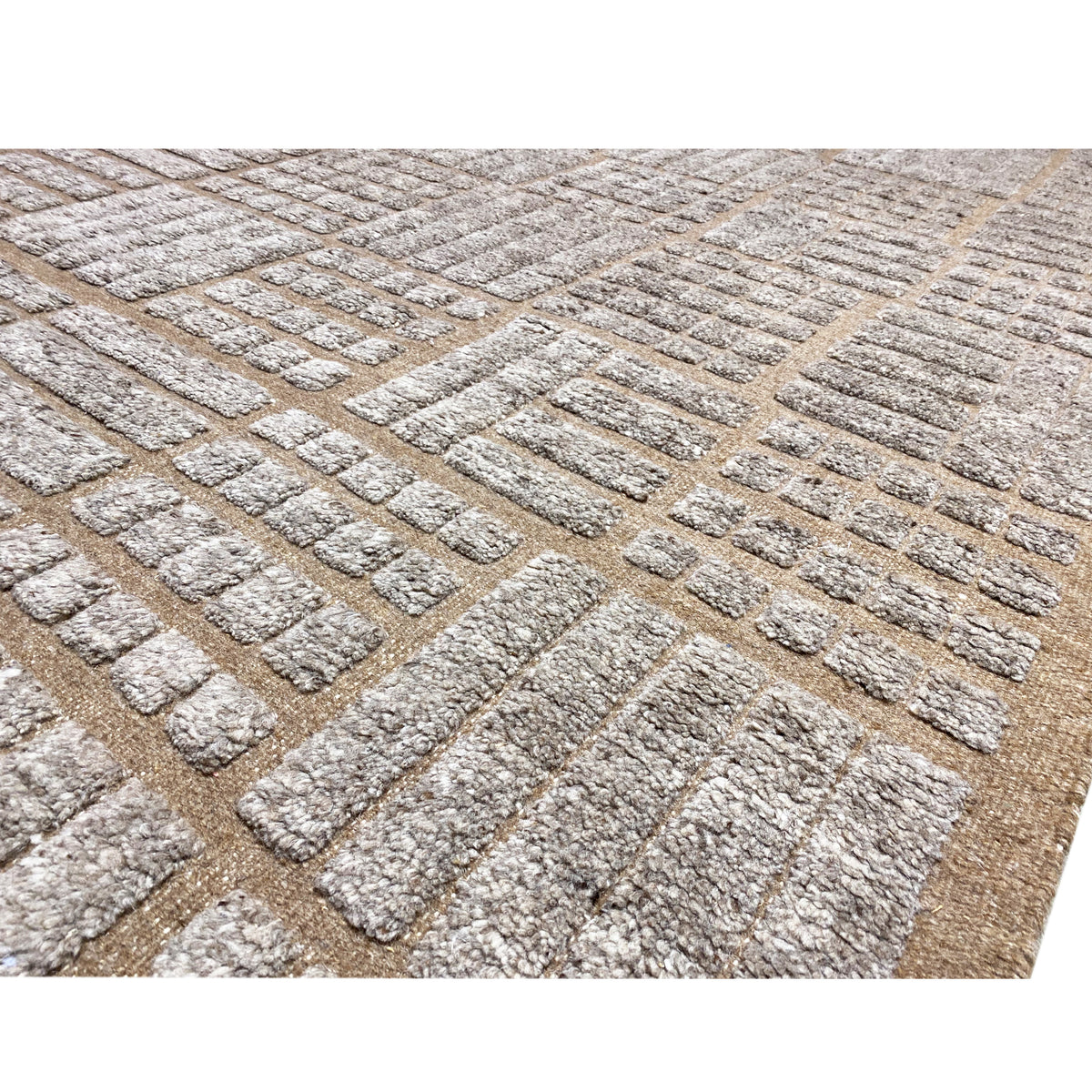 Carpet surface with patterned fabric and raised relief textures in brown and beige