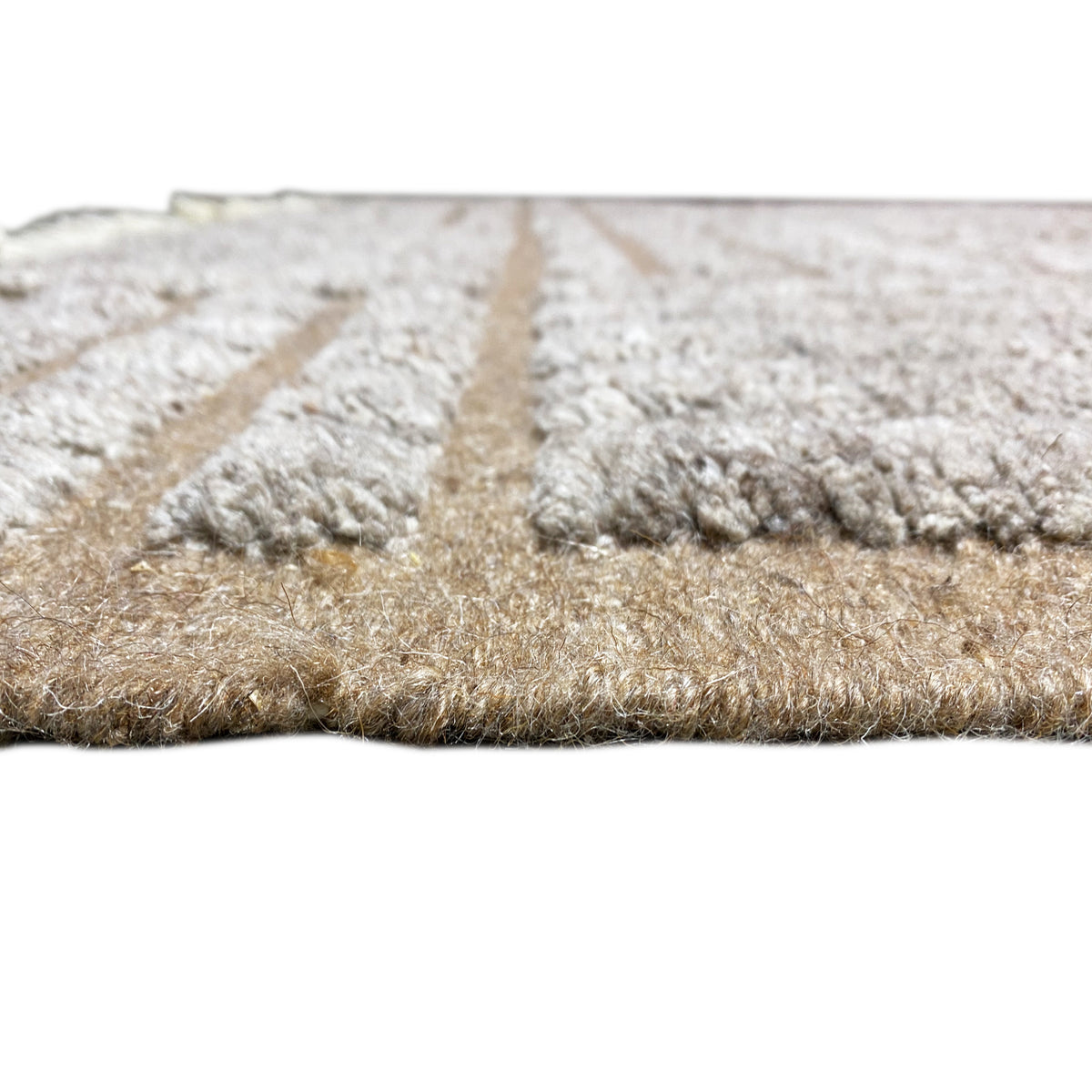 Rug backing with dense, fluffy fibers and a textured edge