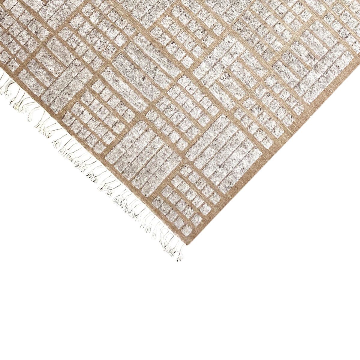 Corner area of the brown rug with a diagonal lattice pattern and white fringes