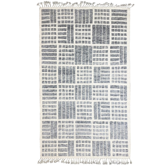 Gray Berber wool rug with a geometric pattern and fringes along the edges