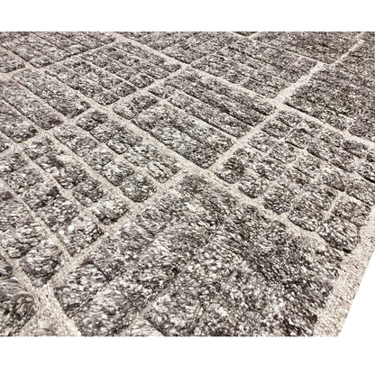 Close-up: Berber rug with a checkered grid in dark gray, mottled texture