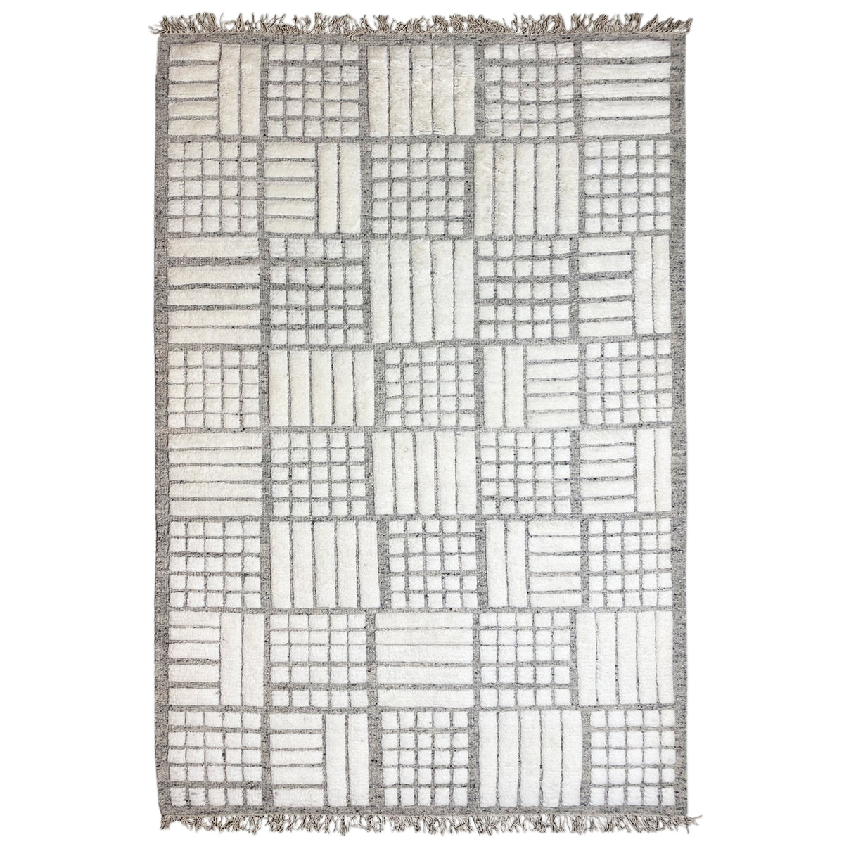 Berber rug with square patchwork in beige, gray, and white, with fringes