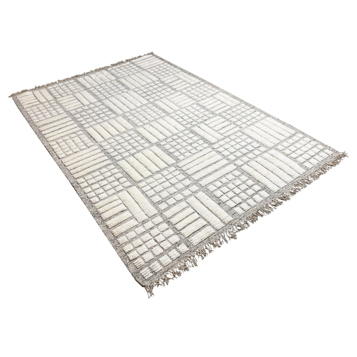 Berber rug with a gray-and-white grid and stripe pattern, fringes