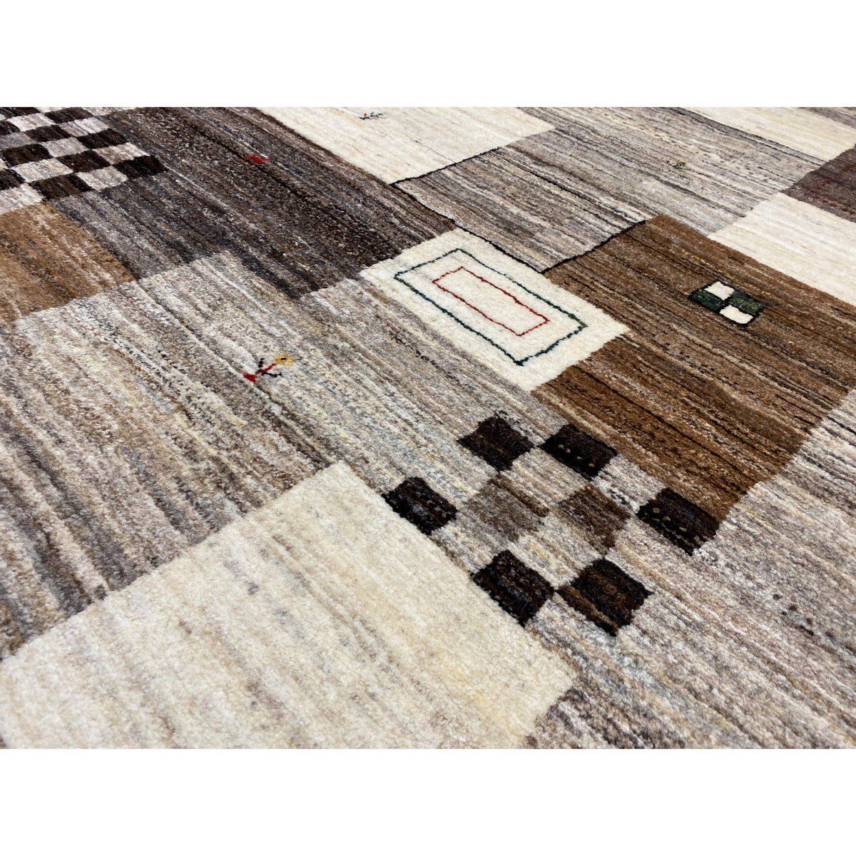 Gabbeh rug detail view: textured weave with contrasting areas