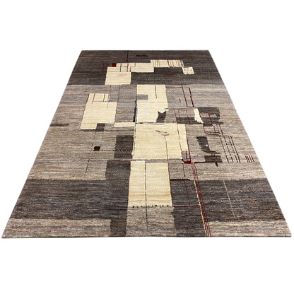 Gabbeh rug in a triangular view with patchwork of light squares and red lines